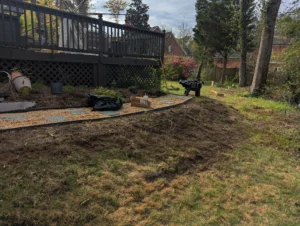 An image showing the unprepared sloped area, to be cleaned up for Dirtlocker installation